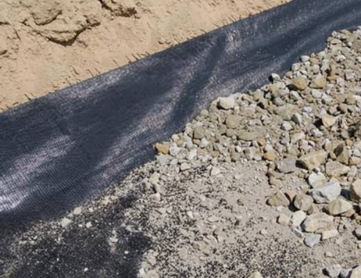 Paver installation process. Laying and compacting Class II road base for superior strength and longevity.